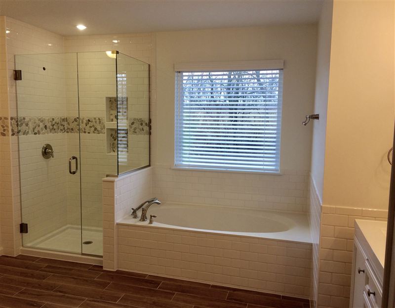 Bathroom remodel with frameless glass shower and soaking tub in Madison County, Illinois