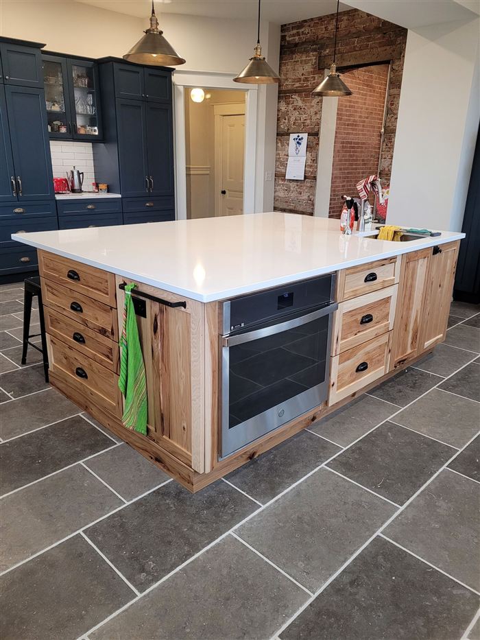 Hickory kitchen island with white quartz counter and built-in oven, Metro East Illinois
