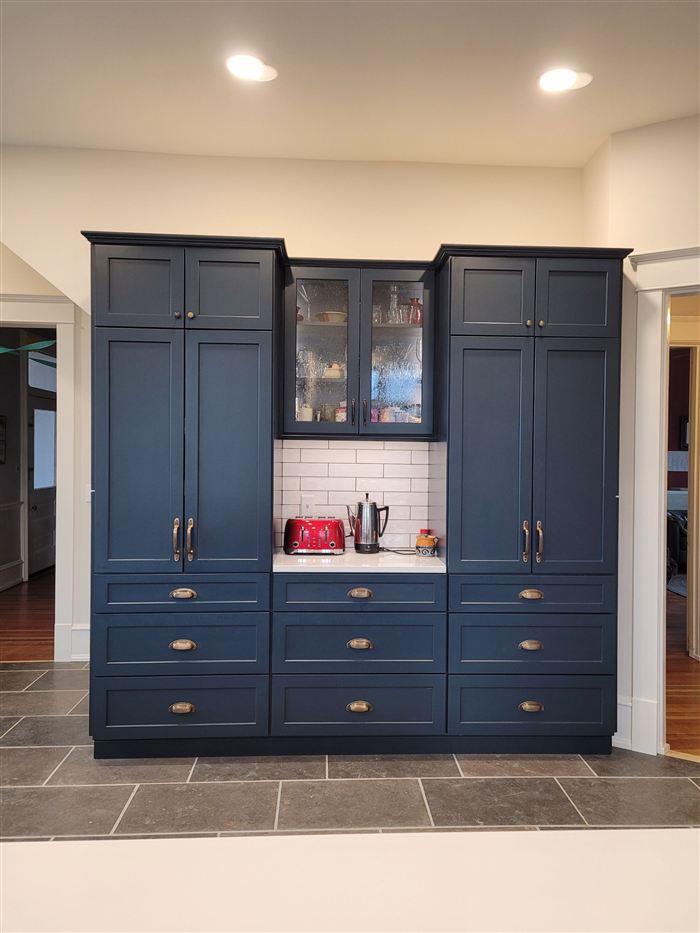 Navy blue custom built-in cabinetry with glass uppers, interior remodel in Illinois