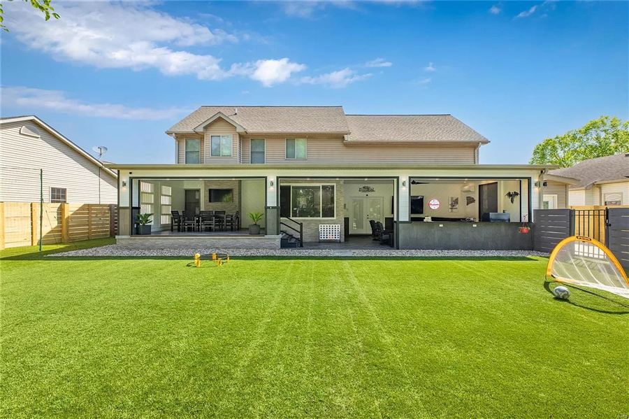 Finished backyard with new turf and the completed outdoor living pavilion — Wisteria Drive